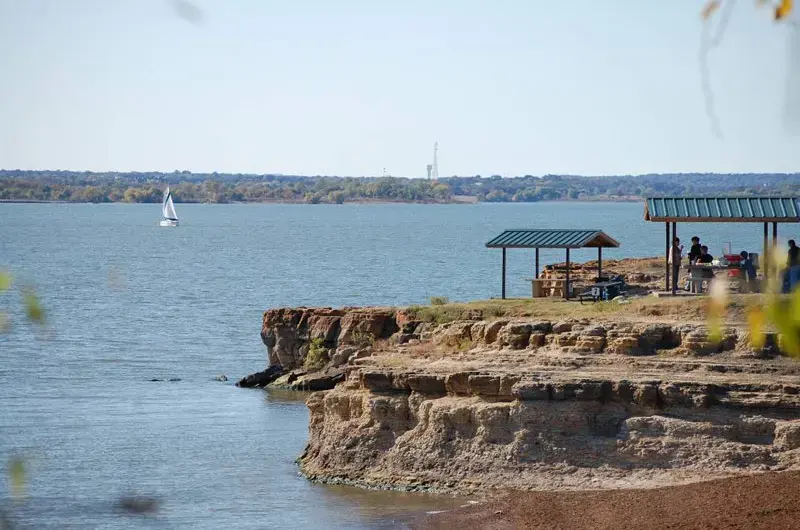 Grapevine Lake shoreline cliffs and a picnic shelter near Flower Mound